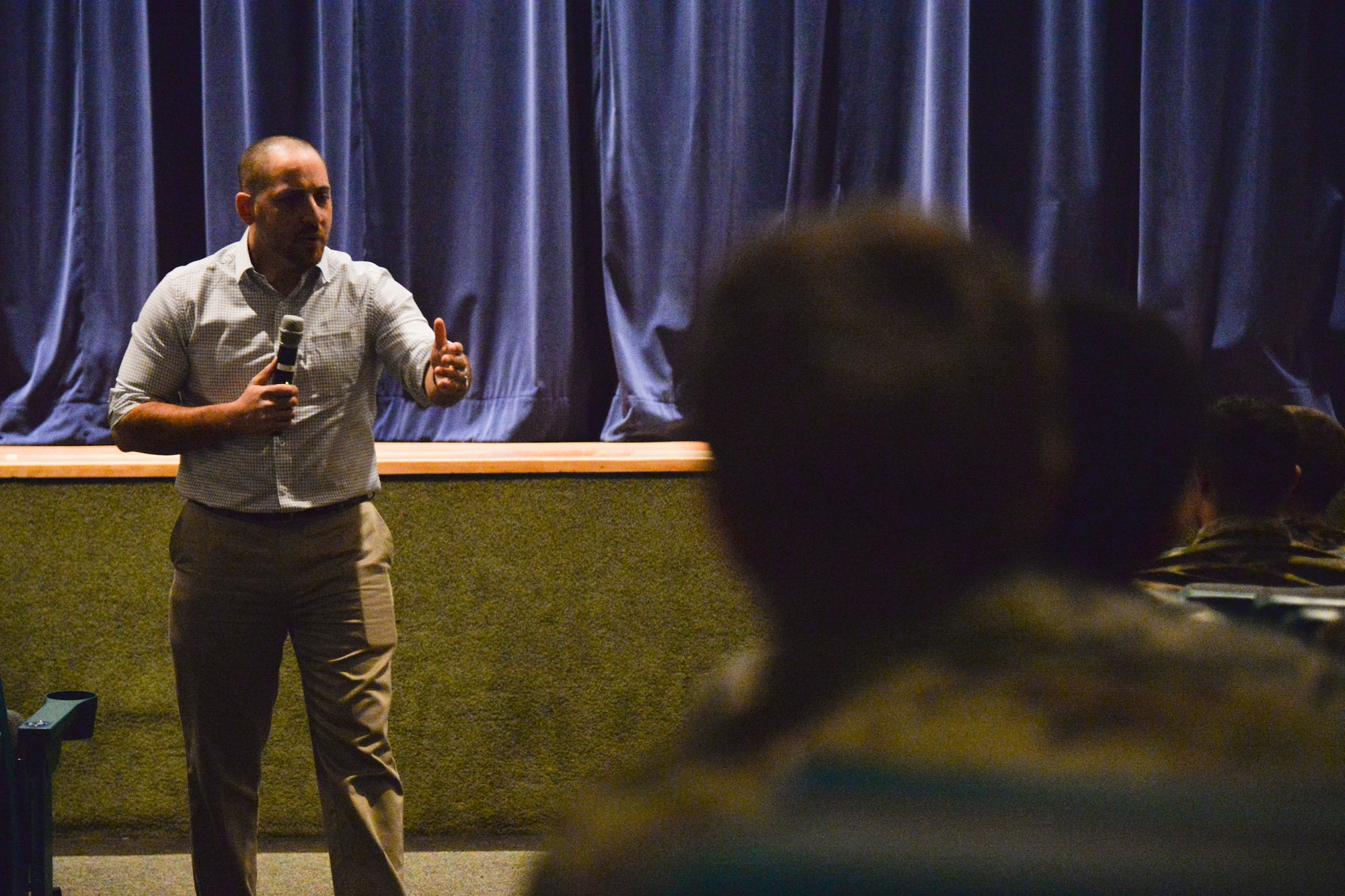 Kevin Hines, a mental health advocate, speaks to Airmen Sept. 28, 2016, at Malmstrom Air Force Base, Mont. Hines attempted to take his own life by jumping off the Golden Gate Bridge, but he survived. He now uses the experience to travel around the world to share his story in hopes to change the lives of others with brain illnesses and suicidal thoughts. (U.S. Air Force photo/Airman 1st Class Daniel Brosam)