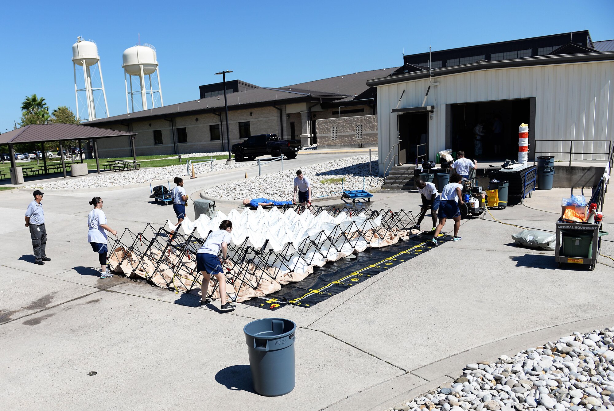 A group of students deploy a tent that will become a medical treatment facility on Laughlin Air Force Base, Texas, Sept. 22, 2016. The team was part of a decontamination training exercise that highlighted combating chemical, biological, radiological and nuclear threats. (U.S. Air Force photo/Airman 1st Class Benjamin N. Valmoja)