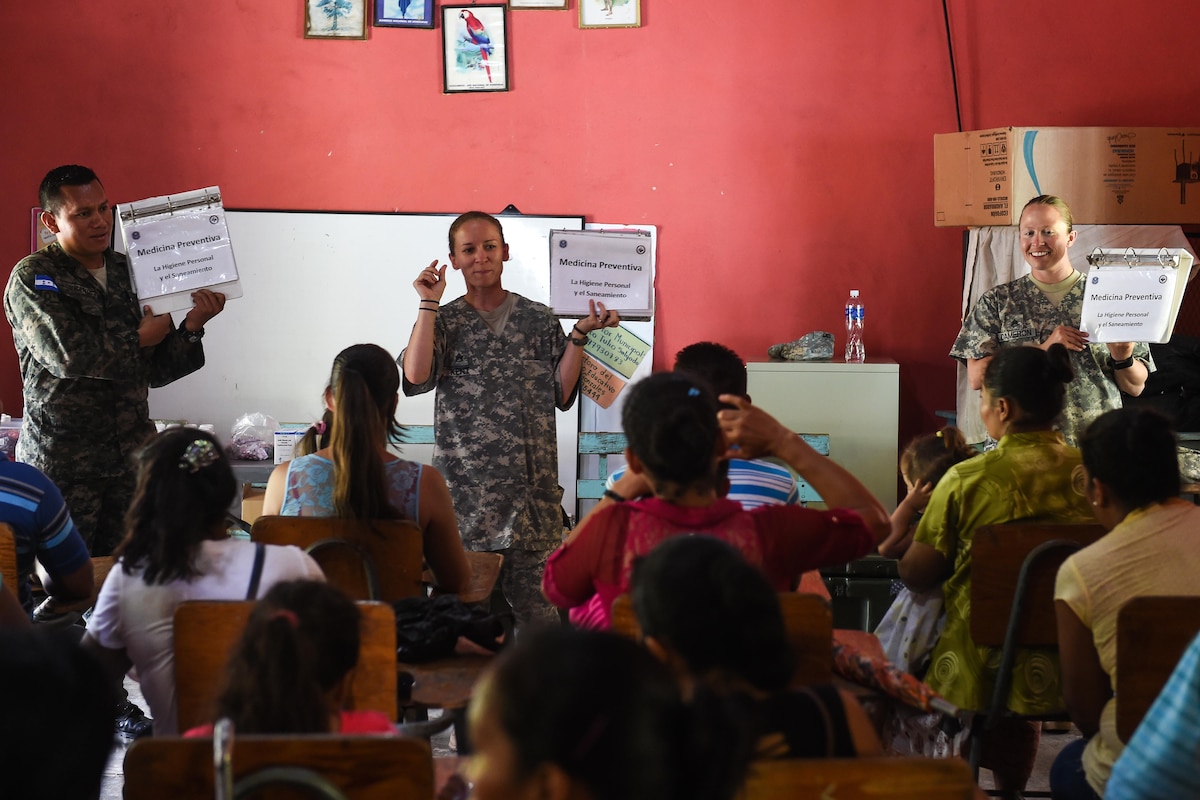 U.S. Army Staff Sgt. Lisa Kent, Joint Task Force-Bravo Medical Element veterinary food inspection specialist, begins a preventive medicine briefing during a medical readiness training exercise, or MEDRETE, in the village of Bacadilla, Olancho district, Honduras, Sept. 22, 2016. During the preventive medicine class, patients learn about the importance of different preventative health aspects, and receive vitamins and soap.