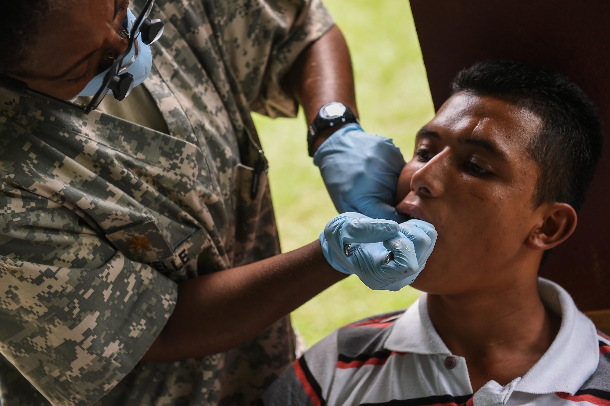 U.S. Army Maj. (Dr.) Lasaundra Estelle, Joint Task Force-Bravo Medical Element dentist, extracts a patient’s tooth during a medical readiness training exercise, or MEDRETE, in the village of Bacadilla, Olancho district, Honduras, Sept. 22, 2016. While MEDRETEs greatly help the local populations where they are conducted, the service members executing the operations also receive valuable medical training and experience that comes from operating in remote and/or austere environments.