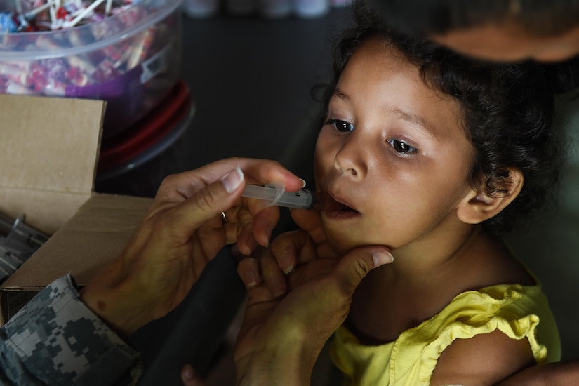 A young girl receives a dose of deworming medicine during a medical readiness training exercise, or MEDRETE, in the village of Bacadilla, Olancho district, Honduras, Sept. 23, 2016. During the two-day MEDRETE, the JTF-Bravo MEDEL team treated more than 800 patients.