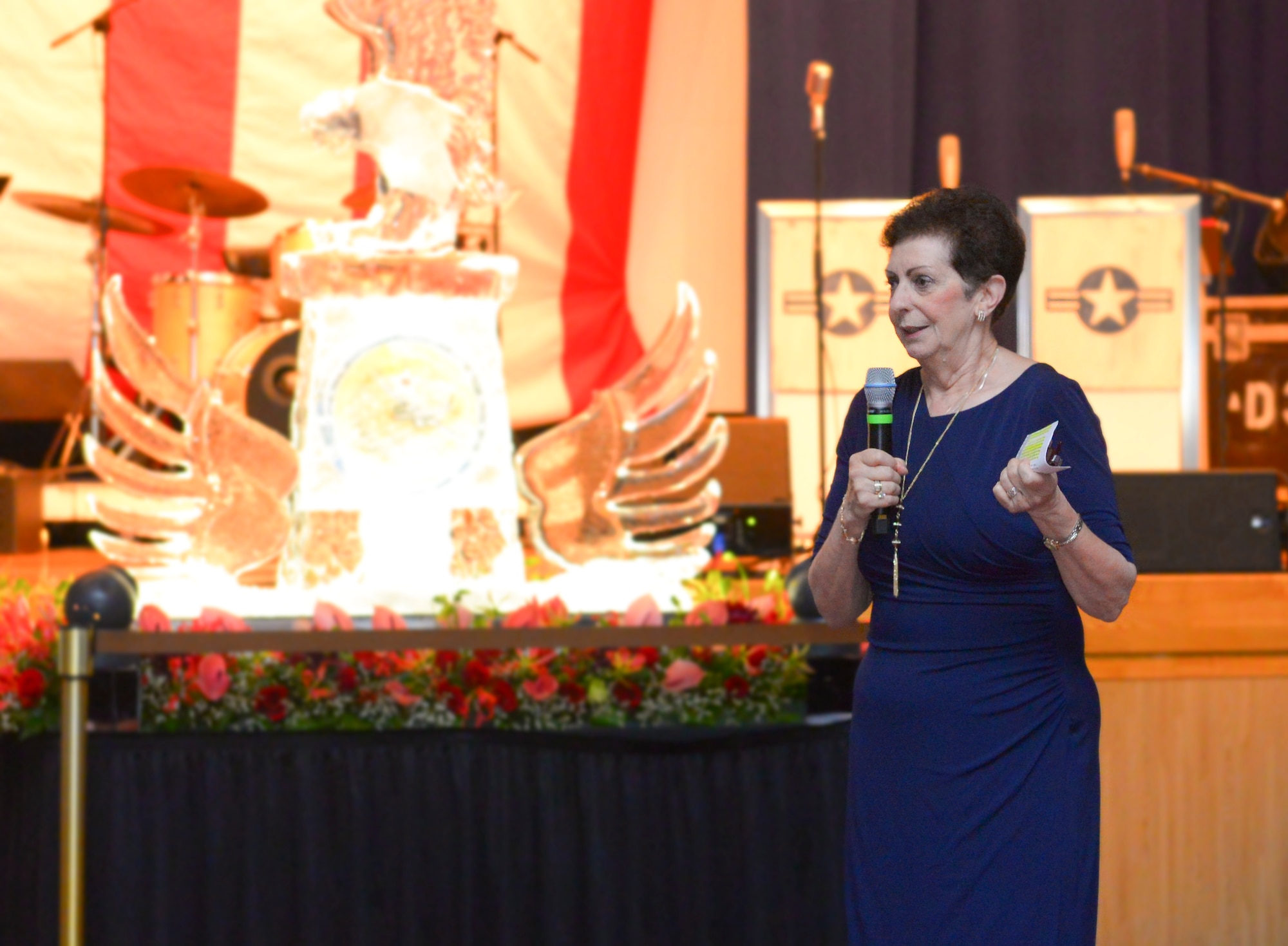 Retired Air Force Col. Regina Aune addresses the crowd during the 69th Annual Air Force Ball at Yokota Air Base, Japan, Sep. 23, 2016. Aune, who served 28 years as a Nurse Corps officer, talked about how to be a hero in the everyday routine of life. (U.S. Air Force photo by Airman 1st Class Elizabeth Baker/Released)