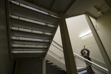 1st Lt. Erin Kan, a U.S. Army Reserve military police officer with the 724th Military Police Battalion, of Fort Lauderdale, Florida, moves up a stairwell during the Active Shooter Threat Response Training taught at an Army Reserve installation in Nashville, Tennessee, on Sept. 27. This training is the first program in the Army Reserve to use the latest tactics taught by federal agents to defend against active shooter incidents, which will eventually train all military police armed guards across the 200th Military Police Command. (U.S. Army Reserve photo by Master Sgt. Michel Sauret)
