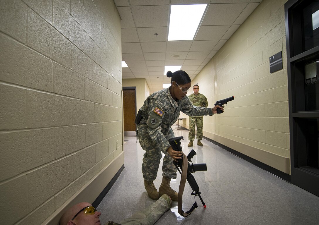 Spc. Megan Barrett, a U.S. Army Reserve military police Soldier with the 724th Military Police Battalion, of Fort Lauderdale, Florida, takes a rifle away from a suspect during the Active Shooter Threat Response Training taught at an Army Reserve installation in Nashville, Tennessee, on Sept. 27. This training is the first program in the Army Reserve to use the latest tactics taught by federal agents to defend against active shooter incidents, which will eventually train all military police armed guards across the 200th Military Police Command. (U.S. Army Reserve photo by Master Sgt. Michel Sauret)