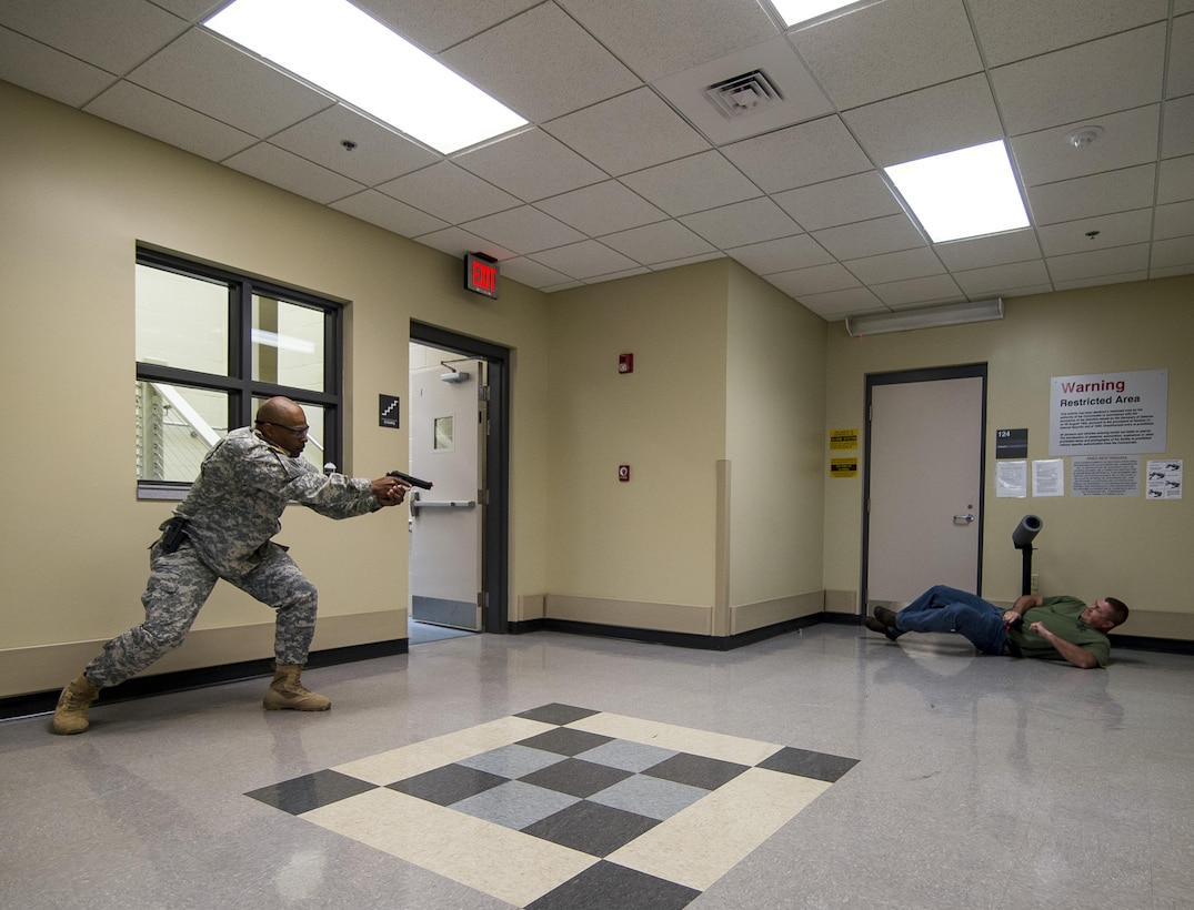 Master Sgt. Steven Webley, U.S. Army Reserve military police Soldier with the 317th Military Police Battalion, headquartered in Tampa, Florida, shoots a supsect during the Active Shooter Threat Response Training taught at an Army Reserve installation in Nashville, Tennessee, on Sept. 29. This training is the first program in the Army Reserve to use the latest tactics taught by federal agents to defend against active shooter incidents, which will eventually train all military police armed guards across the 200th Military Police Command. (U.S. Army Reserve photo by Master Sgt. Michel Sauret)