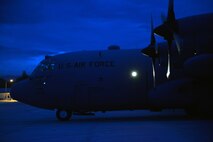 Brigadier General Benito N Ebuen Air Base, Lapu-Lapu City, Philippines—Air Base, Lapu-Lapu City, Philippines—A marshal from the Philippine Air Force directs a Philippine Air Force C-130 to its ramp position following the first bilateral mission of the current iteration of a rotational Air Contingent in the Philippines Sept 26. Two C-130 Hercules aircraft and crews from 374th Airlift Wing, Yokota Air Base, Japan, the 36th Contingency Response Group from Andersen Air Force Base, Guam, and other units from across U.S. Pacific Command will conduct bilateral training missions and subject matter expert exchanges alongside their Philippine Air Force counterparts. The Air Contingent is helping build the capacity of the Philippine Air Force and increases joint training, promotes interoperability and provides greater and more transparent air and maritime situational awareness to ensure safety for military and civilian activities in international waters and airspace. Its missions include air and maritime domain awareness, personnel recovery, combating piracy, and assuring access to the air and maritime domains in accordance with international law. (U.S. Air Force photo by Capt. Mark Lazane)