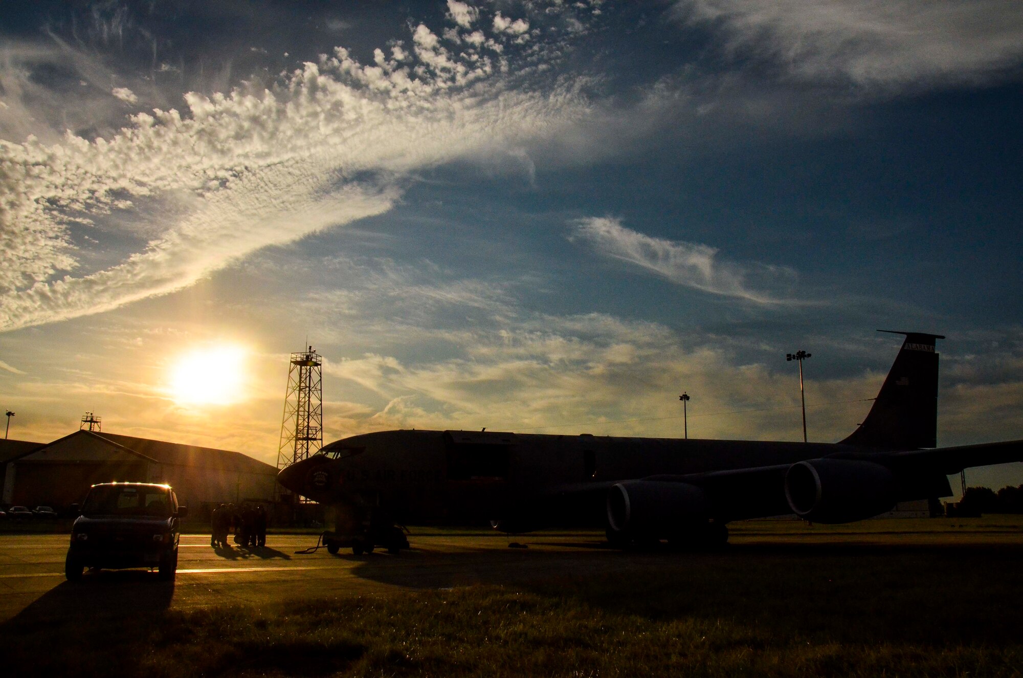 The sun rises over a KC-135R Stratotanker from the 117th Air Refueling Wing as crew members conduct a pre-flight meeting at RAF Mildenhall, England, Aug. 24, 2016. (U.S. Air National Guard photo by: Senior Airman Wesley Jones)