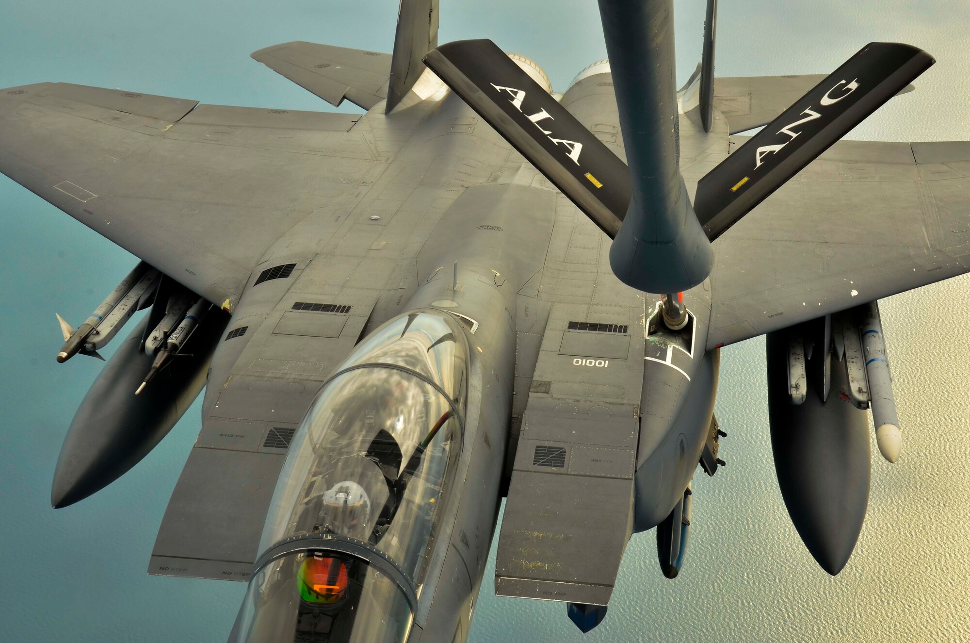 An F-15E Strike Eagle, 494th Fighter Squadron, RAF Lakenheath, England is refueled by a KC-135R Stratotanker, 117th Air Refueling Wing, Birmingham, Ala., Aug. 24, 2016, over the Atlantic Ocean. (U.S. Air National Guard photo by: Senior Airman Wesley Jones)
