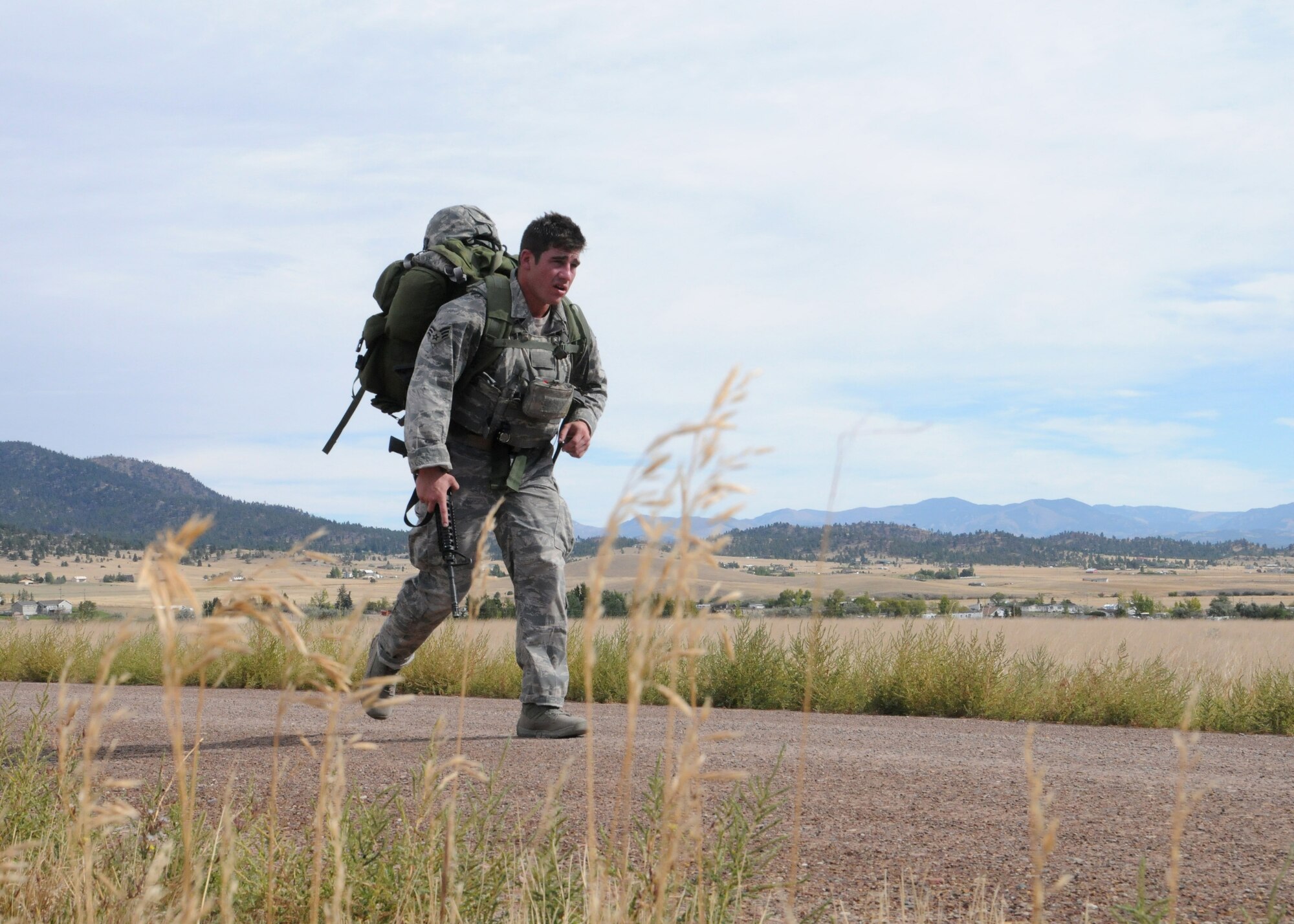 Senior Airman Brendan O’Neill, 120th Civil Engineer Squadron Fire Protection, fire fighter, maintains second place carrying 65 pounds of gear in his rucksack during a 12-mile ruck march at Fort Harrison, Mont., Sept. 10, 2016. O’Neill, one of the first two Airmen to compete in the Montana National Guard’s “Best Warrior Competition” placed second in the enlisted category. (U.S. Air National Guard photo by Staff Sgt. Lindsey Soulsby/Released)
