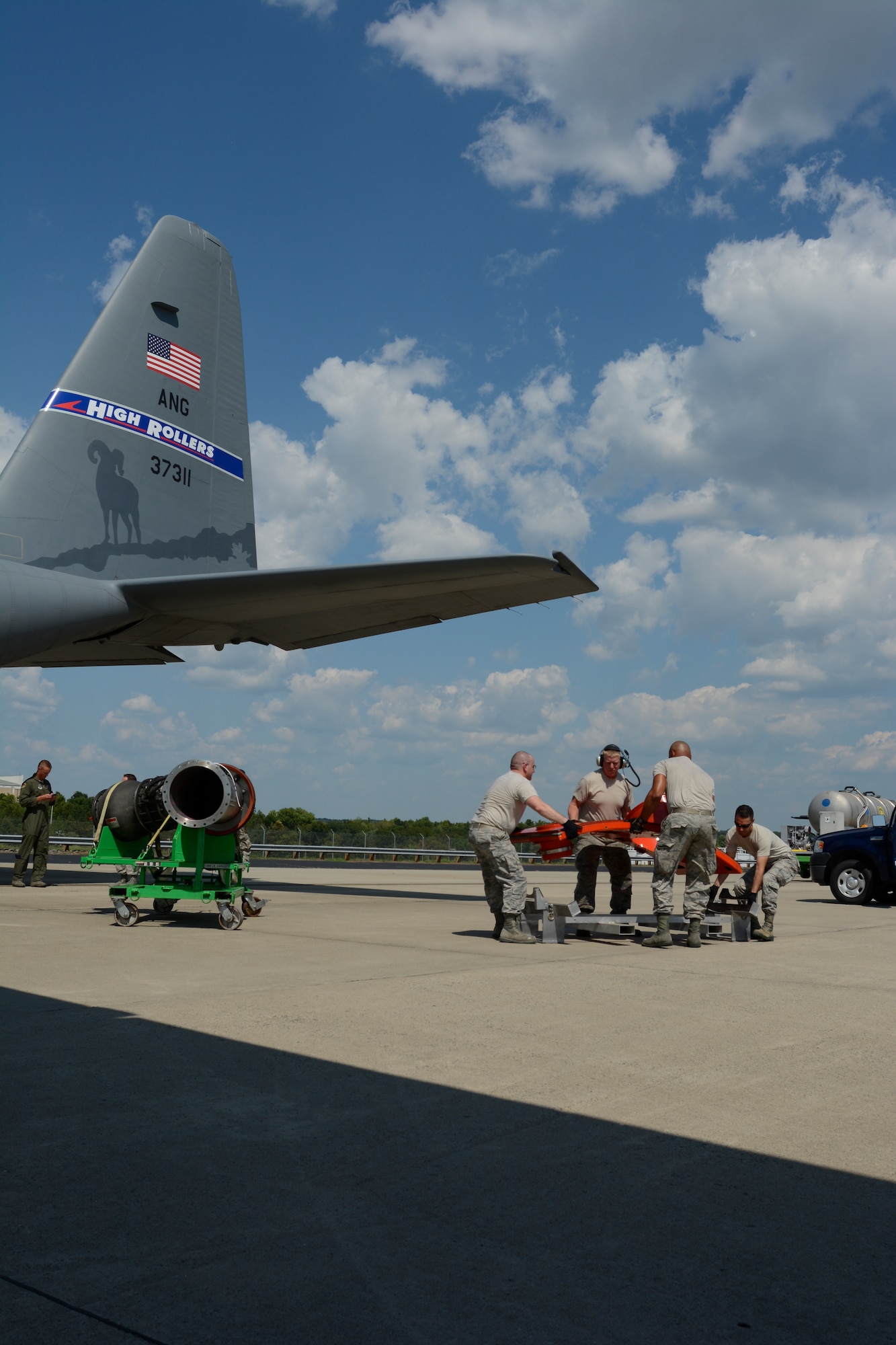 Airmen of the North Carolina Air National Guard loaded the door to the Modular Airborne Fire Fighting System in to the back of a C-130 belonging to the 152nd to be transported to its new home with the Nevada Air National Guard, 152nd Airlift Wing at the North Carolina Air National Guard (NCANG) Base, Charlotte Douglas International Airport, Sept. 7, 2016. (U.S. Air National Guard photo by 1st Lt Monica Ebert)