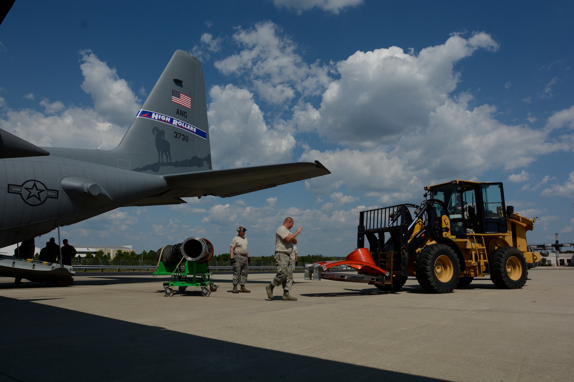 Airmen of the North Carolina Air National Guard loaded the door to the Modular Airborne Fire Fighting System in to the back of a C-130 belonging to the 152nd to be transported to its new home with the Nevada Air National Guard, 152nd Airlift Wing at the North Carolina Air National Guard (NCANG) Base, Charlotte Douglas International Airport, Sept. 7, 2016. (U.S. Air National Guard photo by 1st Lt Monica Ebert)