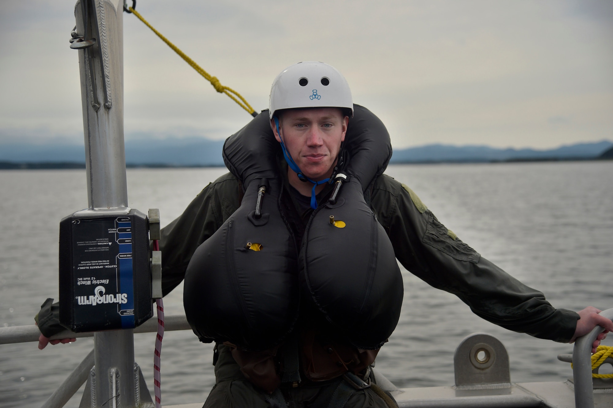 U.S. Air Force Senior Airman Kyle Gergel, a power production journeyman with the 35th Civil Engineer Squadron and a Survival, Evasion, Resistance, and Escape support volunteer, poses for a photo on Lake Ogawara at Misawa Air Base, Japan, Sept. 20, 2016. Because there are only two SERE specialists on-station, training scenarios, like the water survival refresher course, depends on volunteers to help create the most realistic and hands-on training for 35th Fighter Wing pilots involved. Volunteers must know how to swim and be in good military standings. (U.S. Air Force photo by Senior Airman Deana Heitzman)