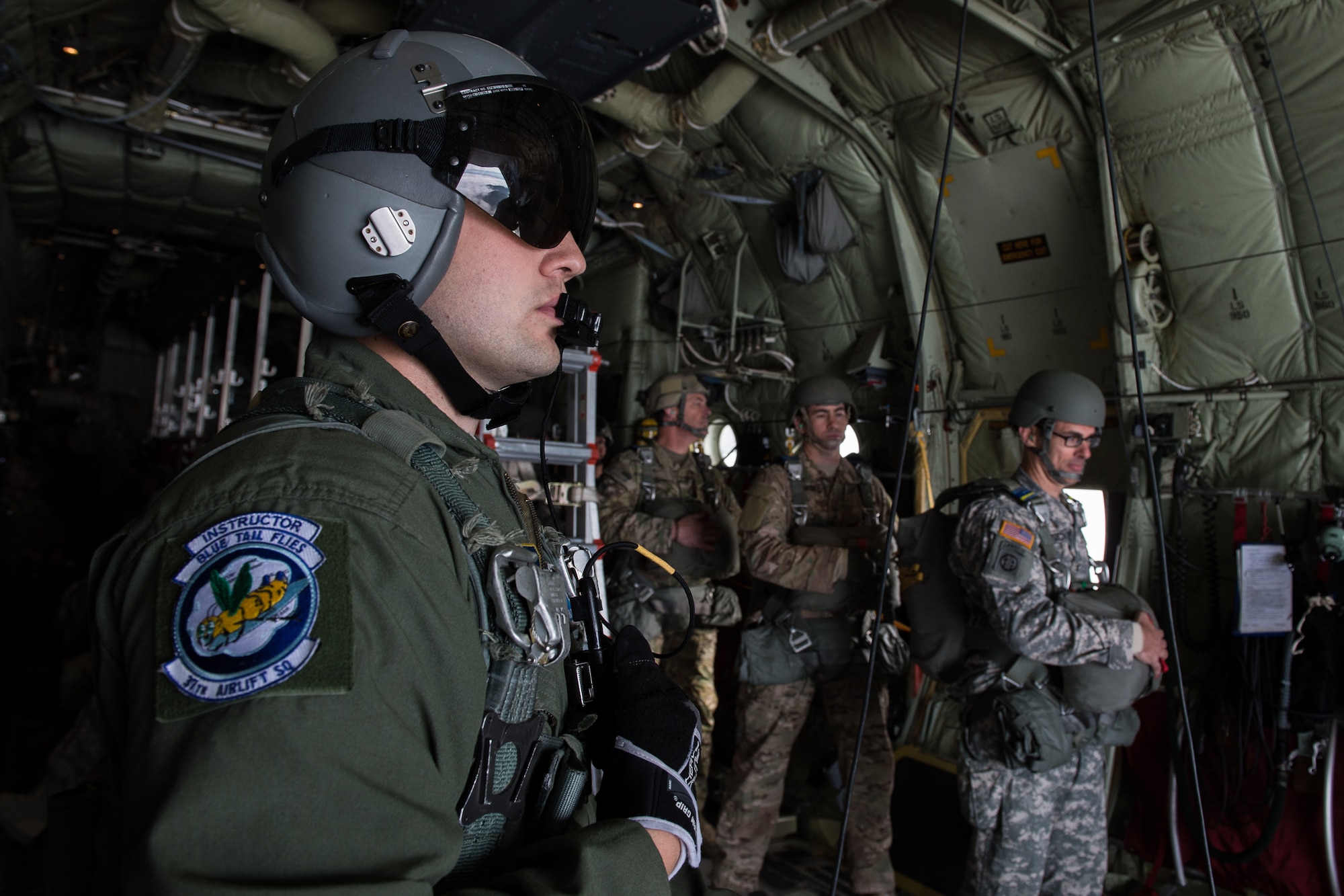 Senior Airman Anthony Oldham, 37th Airlift Squadron loadmaster, prepares Soldiers to jump from a C-130J Hercules over the skies of Germany, Sept. 21, 2016. Oldham saved the life of a local civilian while on temporary assignment to Poland by pinching off the man’s jugular vein, Oct. 17, 2015. (U.S. Air Force photo by Senior Airman Nesha Humes)