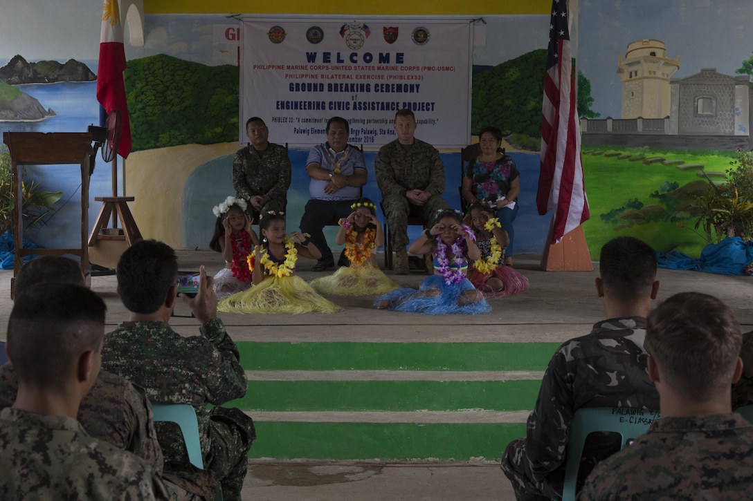U.S. and Philippine Marines and Sailors watch as the students of Palawig Elementary School perform during the engineering civic assistance project ground breaking ceremony for Philippine Amphibious Landing Exercise 33 (PHIBLEX) Sept 23, 2016. PHIBLEX 33 is an annual U.S.-Philippine military bilateral exercise that combines amphibious landing and live-fire training with humanitarian civic assistance efforts to strengthen interoperability and working relationships (U.S. Marine Corps photo by MCIPAC Combat Camera Cpl. Allison Lotz/Released)