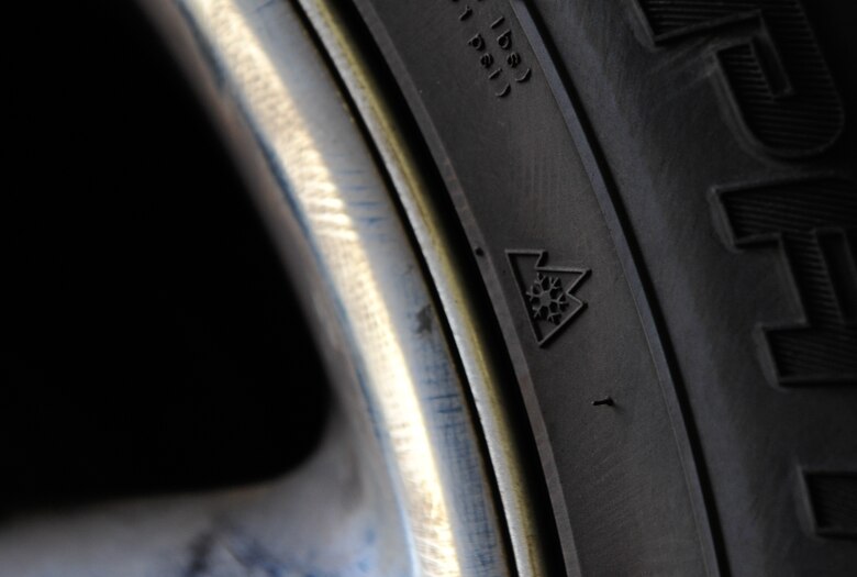 A snowflake is imprinted on a winter tire Sept. 28, 2016, at Ramstein Air Base, Germany. One way to check if your tires are either all-season or winter is to check for either the “M+S” lettering or the symbol of a three-peak mountain or snow flake. (U.S. Air force photo/Airman 1st Class Lane T. Plummer)