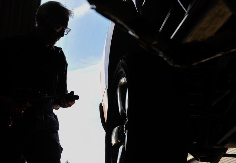 Greg Hermann, 86th Force Support Squadron tire technician, installs a winter tire on a customer’s truck Sept. 28, 2016, at Ramstein Air Base, Germany. One way the Kaiserslautern Military Community can get their tires installed is by visiting the Auto Hobby shop on base, where trained technicians can prepare them for the winter by properly weighing and installing them. (U.S. Air force photo/Airman 1st Class Lane T. Plummer)