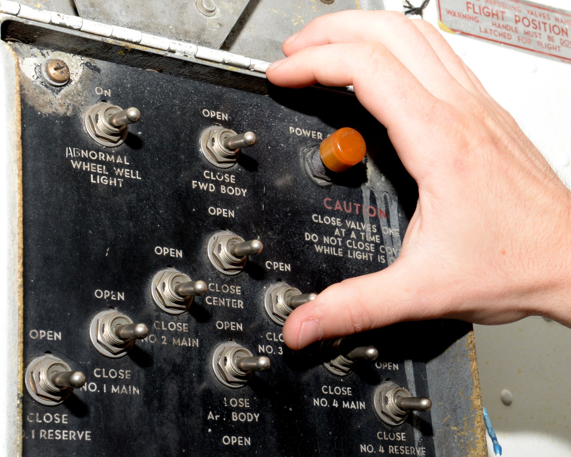 U.S. Air Force Senior Airman Tyler Harvey, 100th Maintenance Squadron shift leader of consolidated tool kits, opens a fuel level control valve Sept. 13, 2016, on RAF Mildenhall, England. A fuel level control valve allows fuel to flow into its respective tank and will shut off when the fuel tank is full. (U.S. Air Force photo by Gina Randall) 
