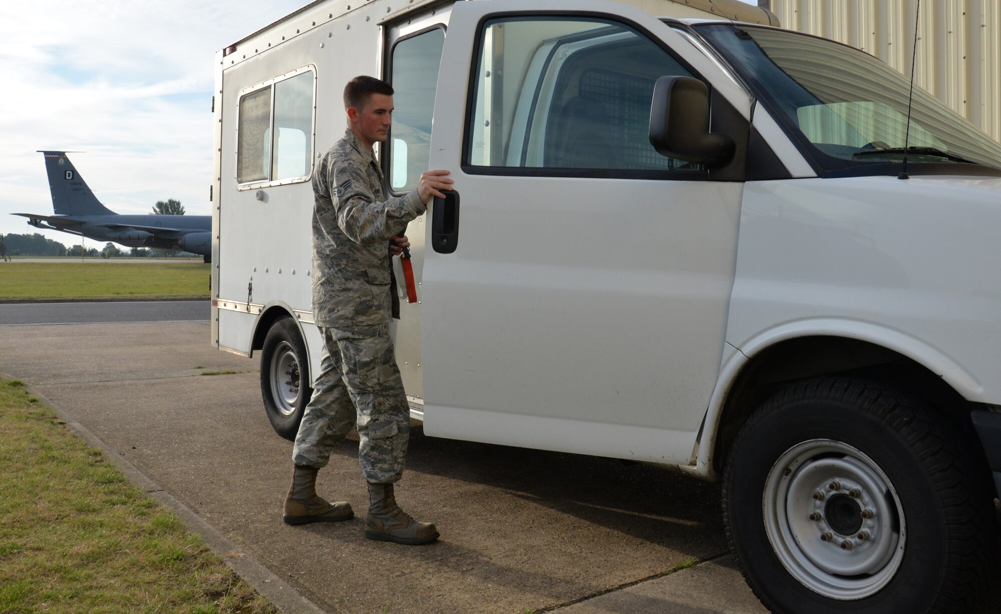 U.S. Air Force Senior Airman Tyler Harvey, 100th Maintenance Squadron shift leader of consolidated tool kits, gets in a government-owned vehicle to head to a tanker needing maintenance Sept. 13, 2016, on RAF Mildenhall, England. Harvey receives calls over the radio on a regular basis for fuel leaks, inoperative components and troubleshooting. (U.S. Air Force photo by Gina Randall)