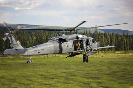 An aircrew with the Alaska Air National Guard’s 210th Rescue Squadron flies at treetop level aboard an HH-60 Pave Hawk helicopter while taking part in a search and rescue training event. Aircrews from the 210th RQS, in addition to crews from the 211th and 212th Rescue Squadrons, rescued an injured hiker near Pioneer Peak, Alaska, Thursday.  Aircrews and pararescue teams from the squadrons often assist the U.S. Coast Guard, Alaska State Troopers, the National Park Service and other agencies with search and rescue missions.