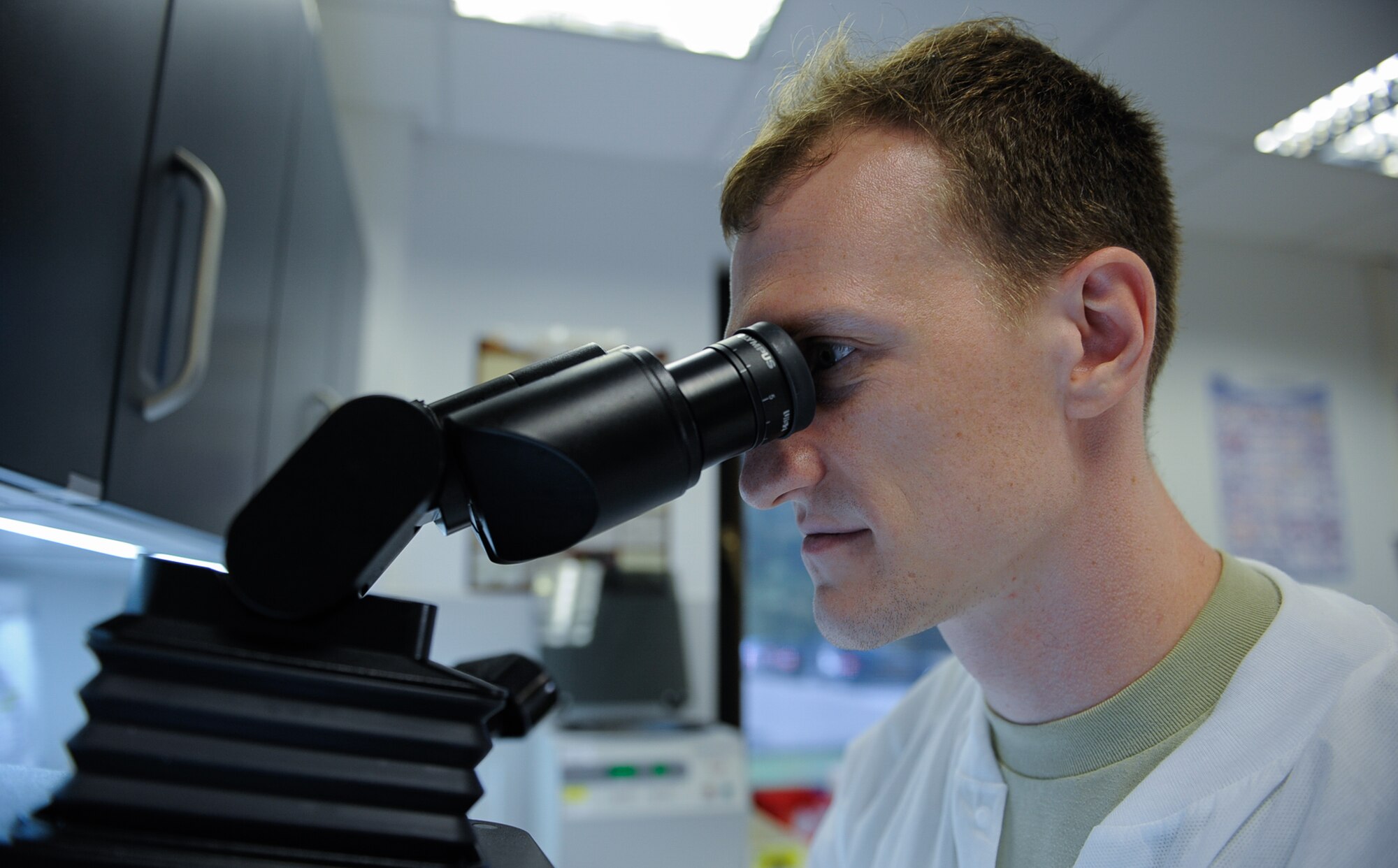 Airman 1st Class Steven Carter, 86th Medical Support Squadron medical laboratory technician, looks into a microscope at Ramstein Air Base Germany, Sept. 29, 2016. The medical laboratory tests samples for things such as pregnancy, cholesterol, glucose levels and more. (U.S. Air Force photo/ Airman 1st Class Savannah L. Waters)

