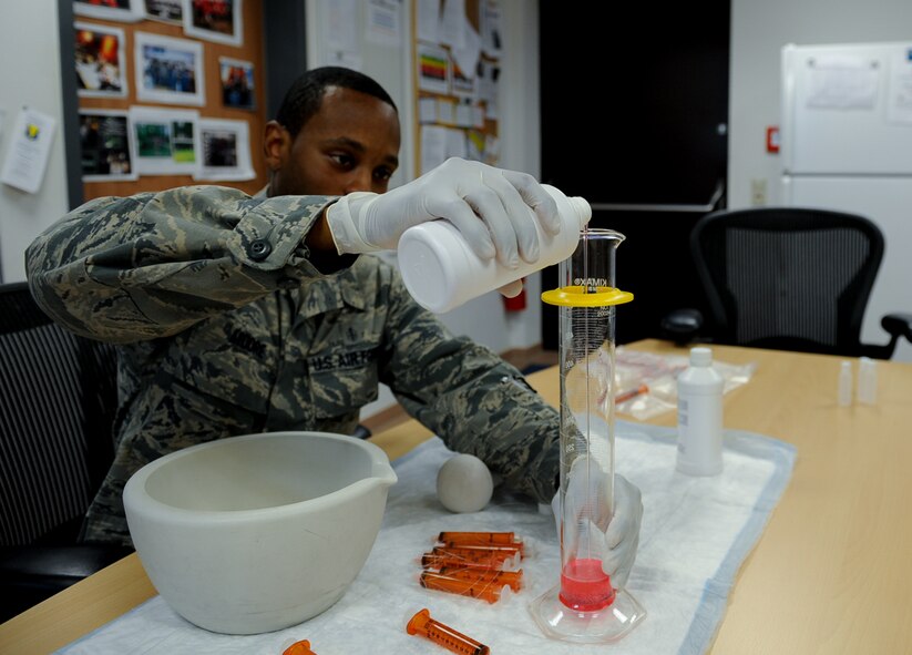 Staff Sgt. Joshua Moore, 86th Medical Support Squadron pharmacy technician, measures a prescription into a graduated cylinder at Ramstein Air Base Germany, Sept. 29, 2016. Pharmacy technicians ensure that patients get the right prescriptions and education on proper use.  (U.S. Air Force photo/ Airman 1st Class Savannah L. Waters)