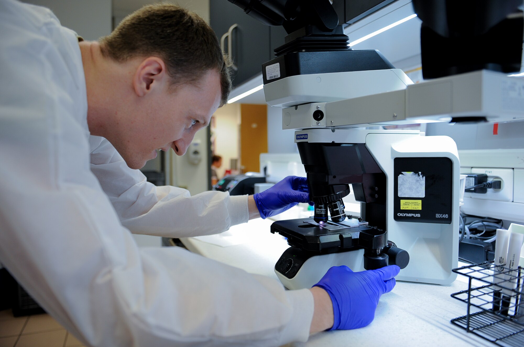 Airman 1st Class Steven Carter, 86th Medical Support Squadron medical laboratory technician, adjusts a microscope at Ramstein Air Base Germany, Sept. 29, 2016.The medical laboratory tests samples for things such as pregnancy, cholesterol, glucose levels and more.  (U.S. Air Force photo/ Airman 1st Class Savannah L. Waters)