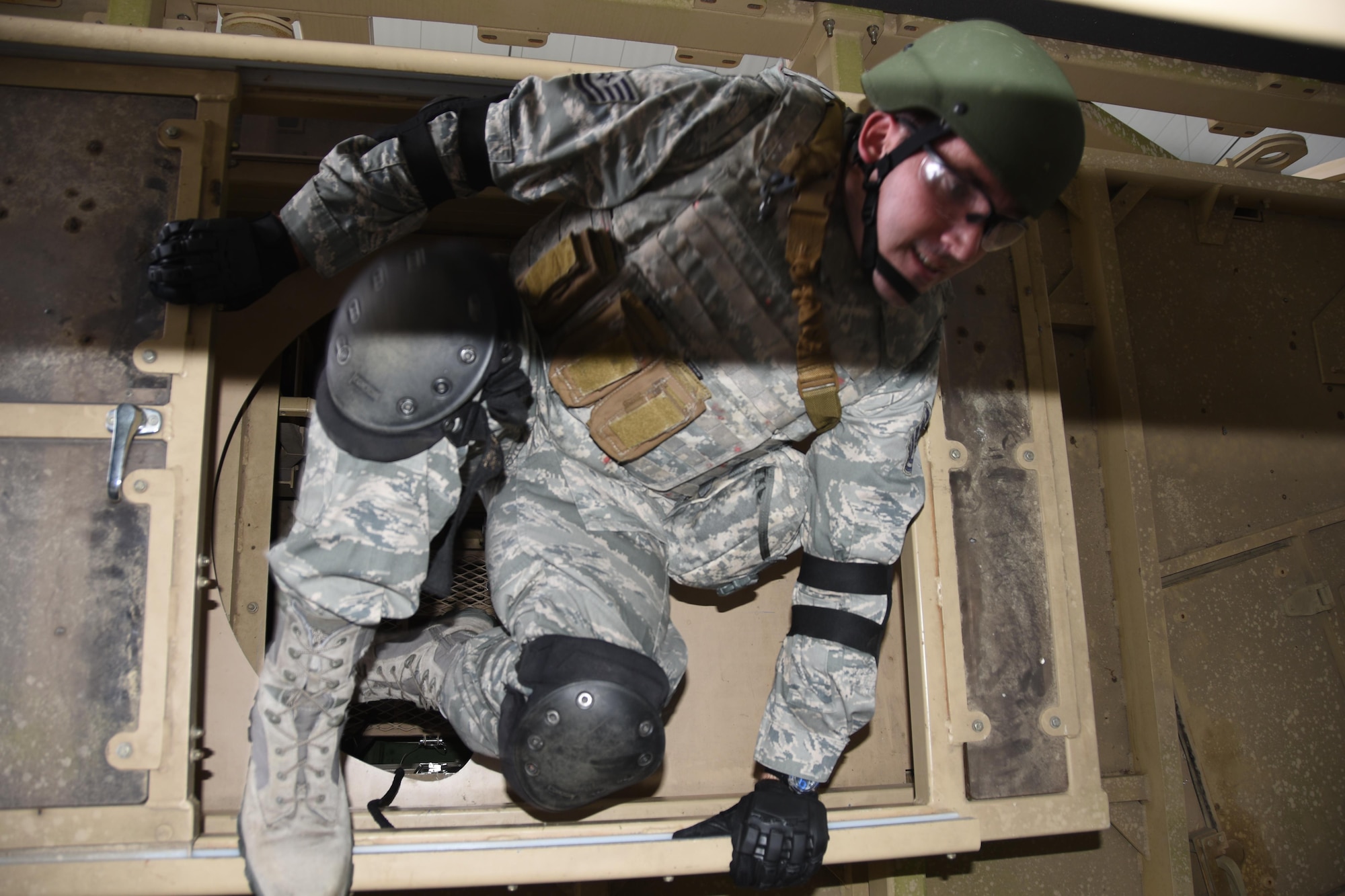 Tech. Sgt. Thomas Bryan, a 5th Combat Communications Group Combat Readiness School student exits a
vehicle rollover trainer at Moody Air Force Base, Georgia. (U.S. Air Force photo by Ed Aspera)