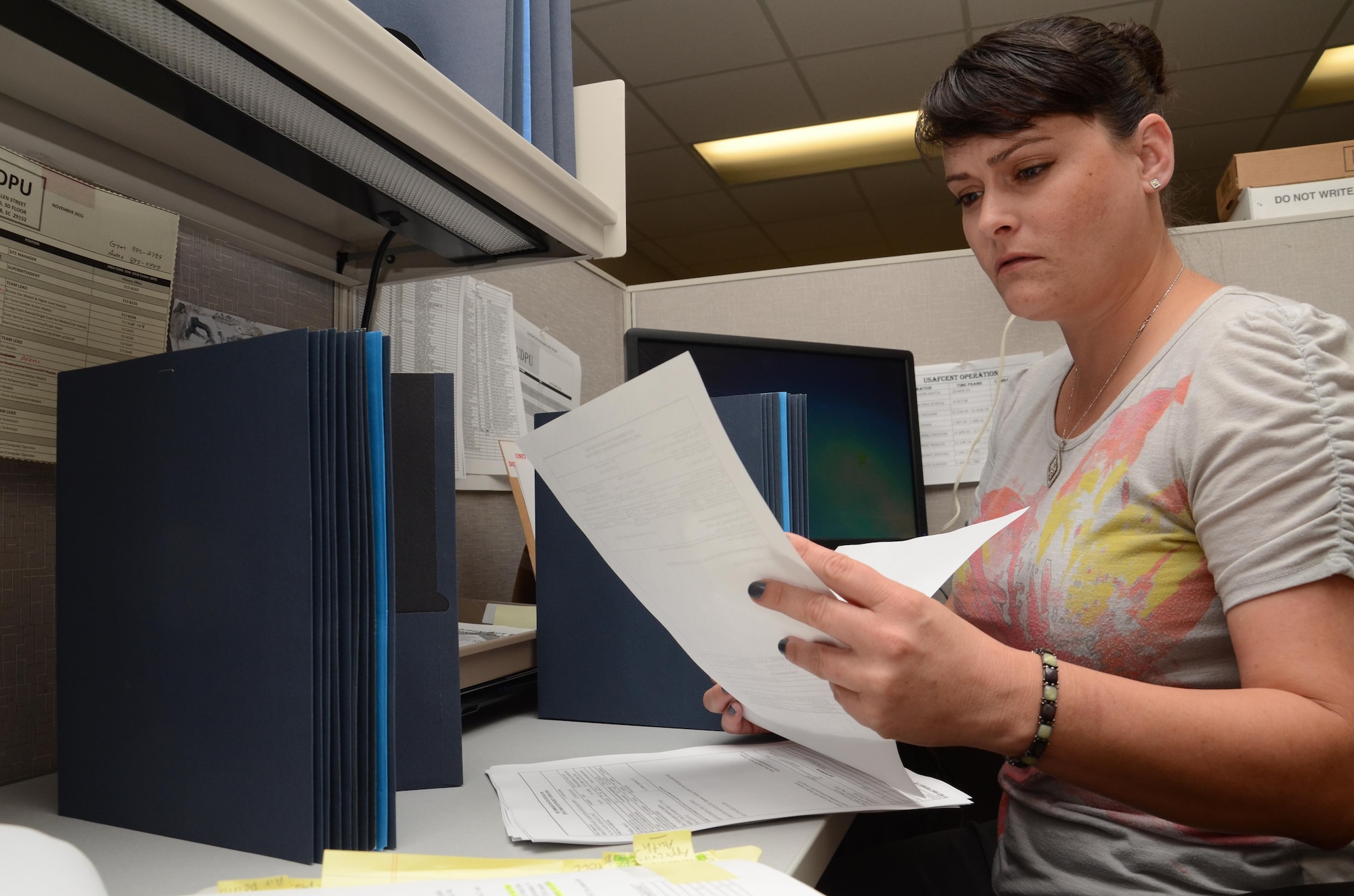 Miranda Pharis, U.S. Air Forces Central Command Decorations Processing Unit data entry technician, processes decorations at Shaw Air Force Base, S.C., Sept. 21, 2016. The UDPU has 21 people processing approximately 300 to 800 submissions a week.  The UDPU will process more than 500,000 military awards and decorations in October. (U.S. Air Force photo by Staff Sgt. Jim Araos)