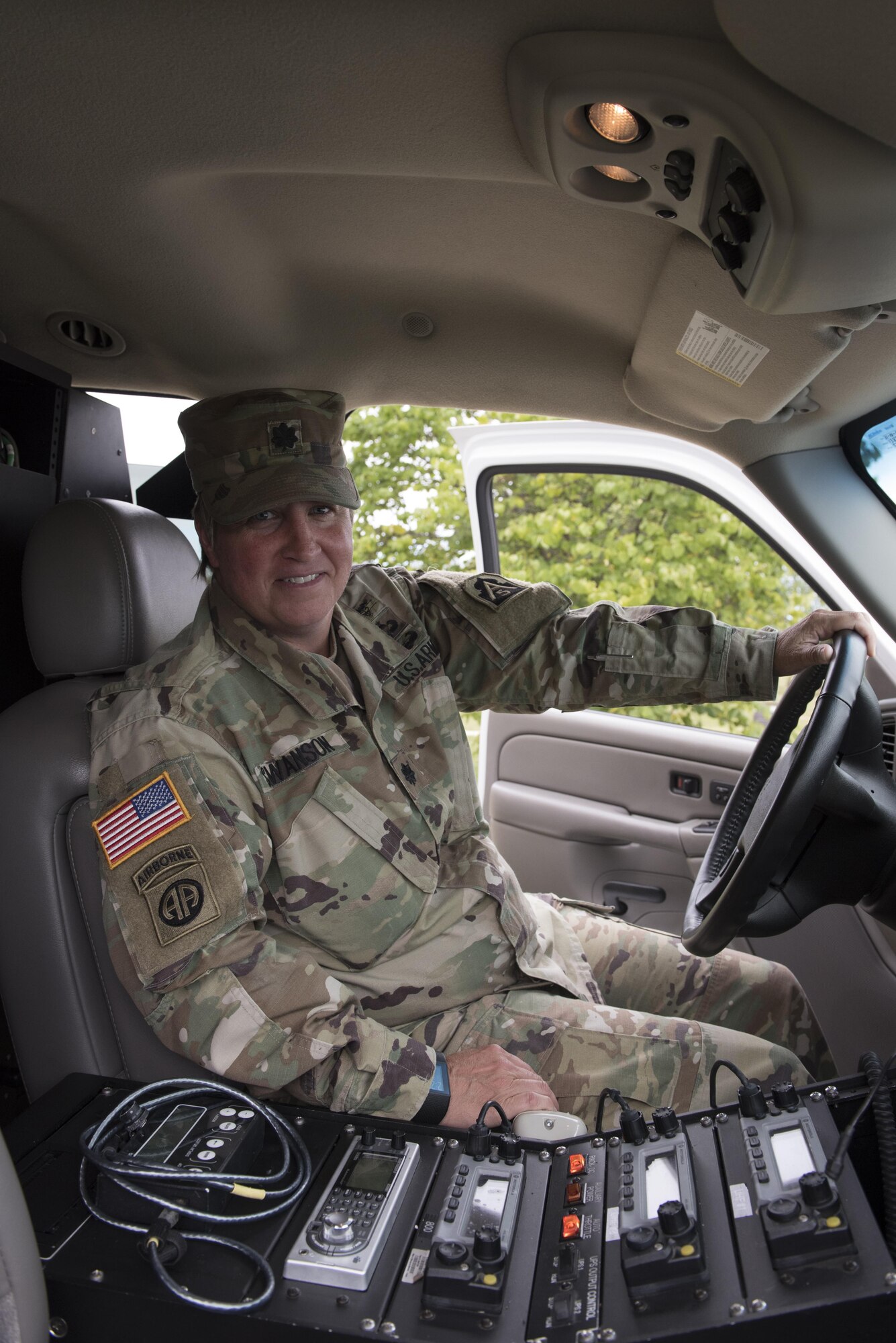 Lt. Col. Kirsten Swanson, Army North Task Force 51 chief of current operations, demonstrates some of the various communication capabilities of the emergency response vehicle temporarily stationed at Joint Base McGuire-Dix-Lakehurst, N.J. Sept. 16, 2016. TF 51 arranged mission essential communication and tracked personnel in and out of the theater in support of the United Nations General Assembly in New York City last week. 