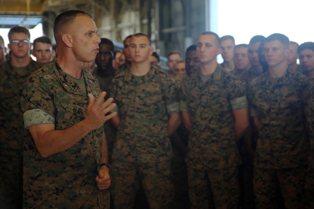 Brig. Gen. Matthew Glavy addresses Marines with Marine Attack Squadron 231 during a pre-deployment brief aboard Marine Corps Air Station Cherry Point, N.C., Sept. 28, 2016. The Marines took a brief pause as part of their pre-deployment preparations to receive a few words of encouragement from the commanding general. Glavy wished the Marines a safe journey as they are slated to continue training for their upcoming deployment in the fall. Glavy is the commanding general of 2nd Marine Aircraft Wing. (U.S. Marine Corps photo by Lance Cpl. Mackenzie Gibson/Released)