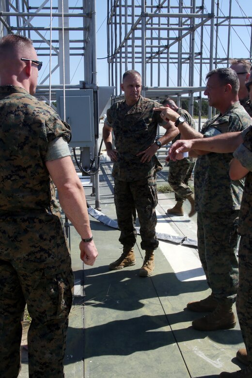 Brig. Gen. Matthew Glavy listens to Marines from the outlying field working group discuss the expeditionary capabilities aboard Marine Corps Auxiliary Landing Field Bogue, N.C., Sept. 28, 2016. Glavy visited the airfield to thank Marines for their hard work, to better understand the challenges they overcome on a daily basis and set eyes on supporting facilities to ensure they are maintained to high standards. “Bogue represents the 2nd Marine Aircraft Wing’s ability to conduct expeditionary operations,” said Glavy. “They provide aviation ground support, air traffic control, and operations support to the aircraft that rely on them. It is a unique place where 2nd MAW can get critical expeditionary training that we cannot receive anywhere else.” Glavy is the commanding general for 2nd MAW. (U.S. Marine Corps photo by Lance Cpl. Mackenzie Gibson/Released)