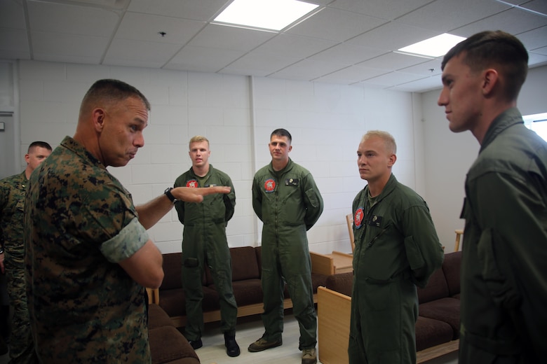 Brig. Gen. Matthew Glavy speaks to Marines with aircraft rescue and firefighting Marines about how their job contributes to mission accomplishment during a visit aboard Marine Corps Auxiliary Landing Field Bogue, N.C., Sept. 28, 2016. Glavy visited the airfield to thank Marines for their hard work, to better understand the challenges they overcome on a daily basis and set eyes on supporting facilities to ensure they are maintained to high standards. “Bogue represents the 2nd Marine Aircraft Wing’s ability to conduct expeditionary operations,” said Glavy. “They provide aviation ground support, air traffic control, and operations support to the aircraft that rely on them. It is a unique place where 2nd MAW can get critical expeditionary training that we cannot receive anywhere else.” Glavy is the commanding general for 2nd MAW. (U.S. Marine Corps photo by Lance Cpl. Mackenzie Gibson/Released)