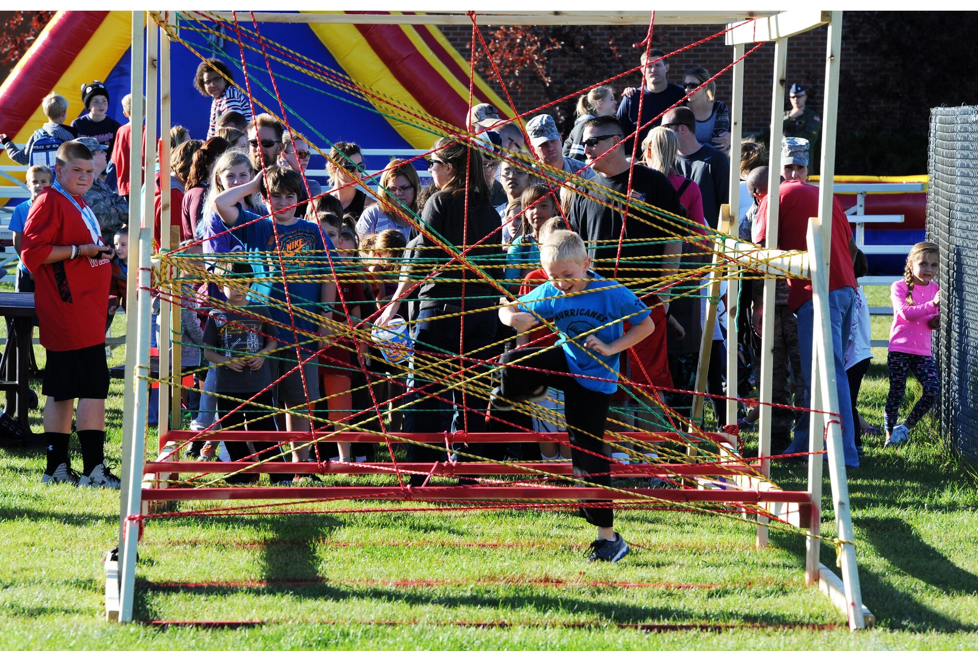 Military families line up at the start of the 2nd Annual Ninja Warrior obstacle course at Minot Air Force Base, N.D., Sept. 26, 2016. The event was held in recognition of the Boys and Girls Club of America’s worldwide day of play. (U.S. Air Force photos/Senior Airman Kristoffer Kaubisch)