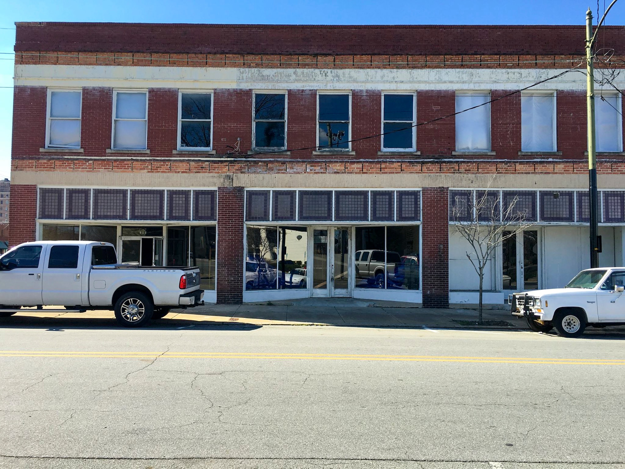 Three N. John Street properties are pictured prior to construction beginning, May 10, 2016, in Downtown Goldsboro, North Carolina. Maj. Christopher Mohr, 77th Air Refueling Squadron operations officer, and his wife Bethany, have been working for the past nine months to revitalize the building, turning its top floor into five apartments and the lower floor into a brewery. (Courtesy photo) 