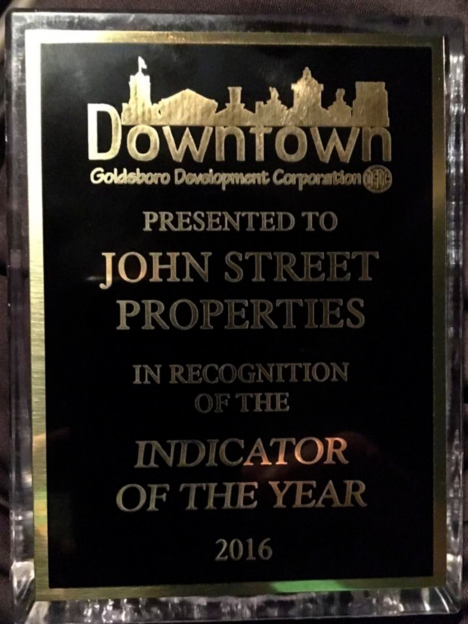 Maj. Christopher Mohr, 77th Air Refueling Squadron operations officer, and his wife Bethany received the Indicator of the Year award, Sept. 23, 2016, in Goldsboro, North Carolina. The Downtown Goldsboro Development Corporation awarded the couple for the renovation work they’ve completed in the downtown area.  (Courtesy photo)