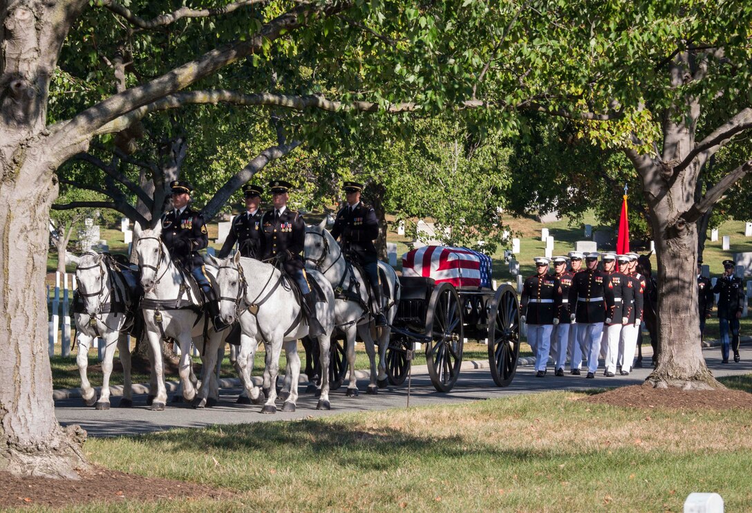 Marine Corps Body Bearers from Bravo Company, Marine Barracks Washington, D.C., escort the casket during a full honors funeral, Sept. 23, 2016 at Arlington National Cemetery, Va. Bravo Company is home to the Marine Corps Body Bearers, those Marines who carry the caskets for all Marine Corps funerals within the National Capitol Region and other set locations. (Official Marine Corps photo by Cpl. Andrianna Daly/Released)
