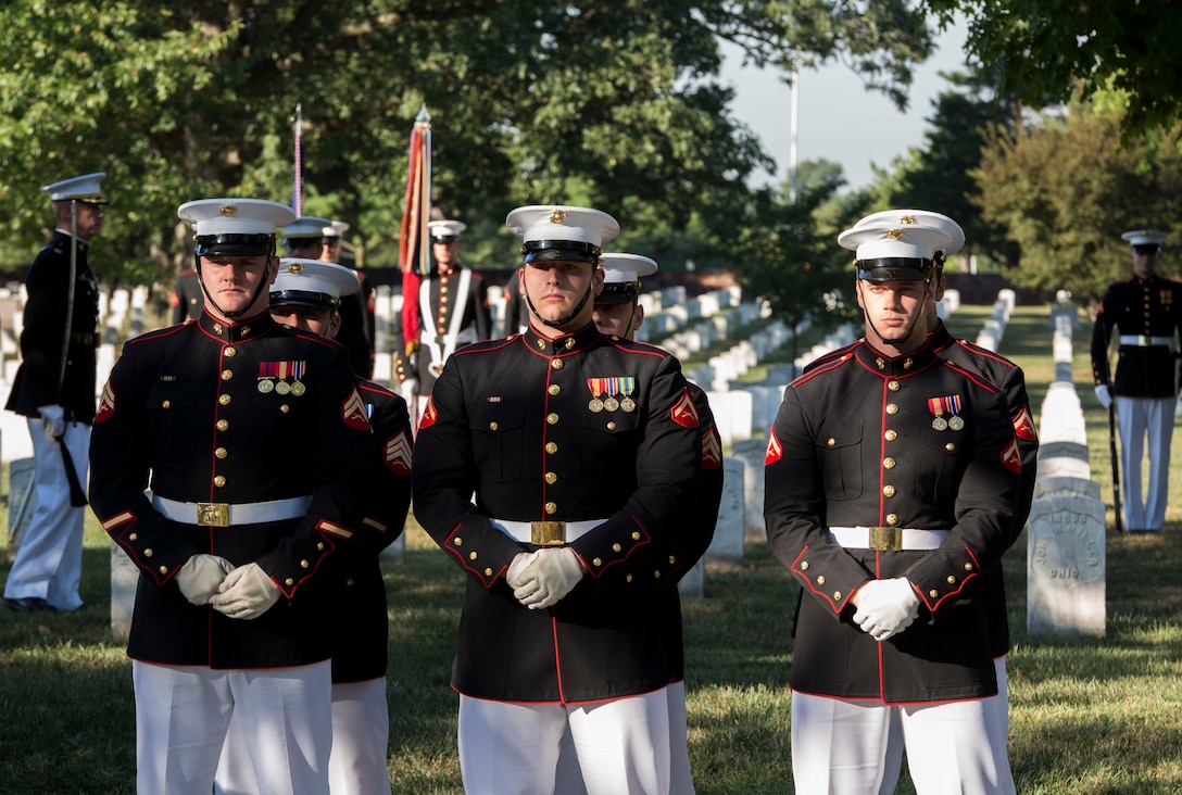 Marine Corps Body Bearers from Bravo Company, Marine Barracks Washington, D.C., await the arrival of the casket during a full honors funeral at Arlington National Cemetery, Va., Sept. 23, 2016. Bravo Company is home to the Marine Corps Body Bearers, those Marines who carry the caskets for all Marine Corps funerals within the National Capitol Region and other set locations. (Official Marine Corps photo by Cpl. Andrianna Daly/Released)