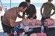 Two pararescumen (PJs) tend to a simulated patient to demonstrate their life-saving medical skills during the 2016 Pararescue Rodeo hosted by the 920th Rescue Wing, Patrick Air Force Base, Florida, September 23, 2016. The rodeo, also known as a skills competition, was a week-long event which tested PJs on skill sets such as precision-parachute jumping, rifle and pistol accuracy shooting, open-ocean surface swimming, high-angle and confined space rescues, water rescues and overall physical endurance. (U.S. Air Force photo/Staff Sgt. Dana White)