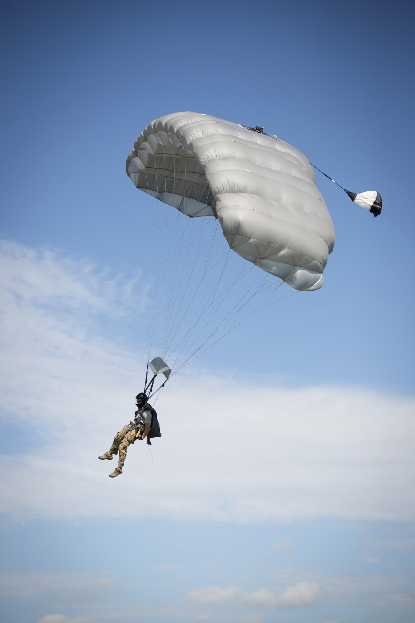A pararescuman, or PJ, glides through the air during the 2016 Pararescue Rodeo hosted by the 920th Rescue Wing, Patrick Air Force Base, Florida, September 19, 2016. The rodeo, also known as a skills competition, was a week-long event which tested PJs on skill sets such as precision-parachute jumping, rifle and pistol accuracy shooting, open-ocean surface swimming, high-angle and confined space rescues, water rescues and overall physical endurance. (U.S. Air Force photo/ 2nd Lt. Katie Spencer)