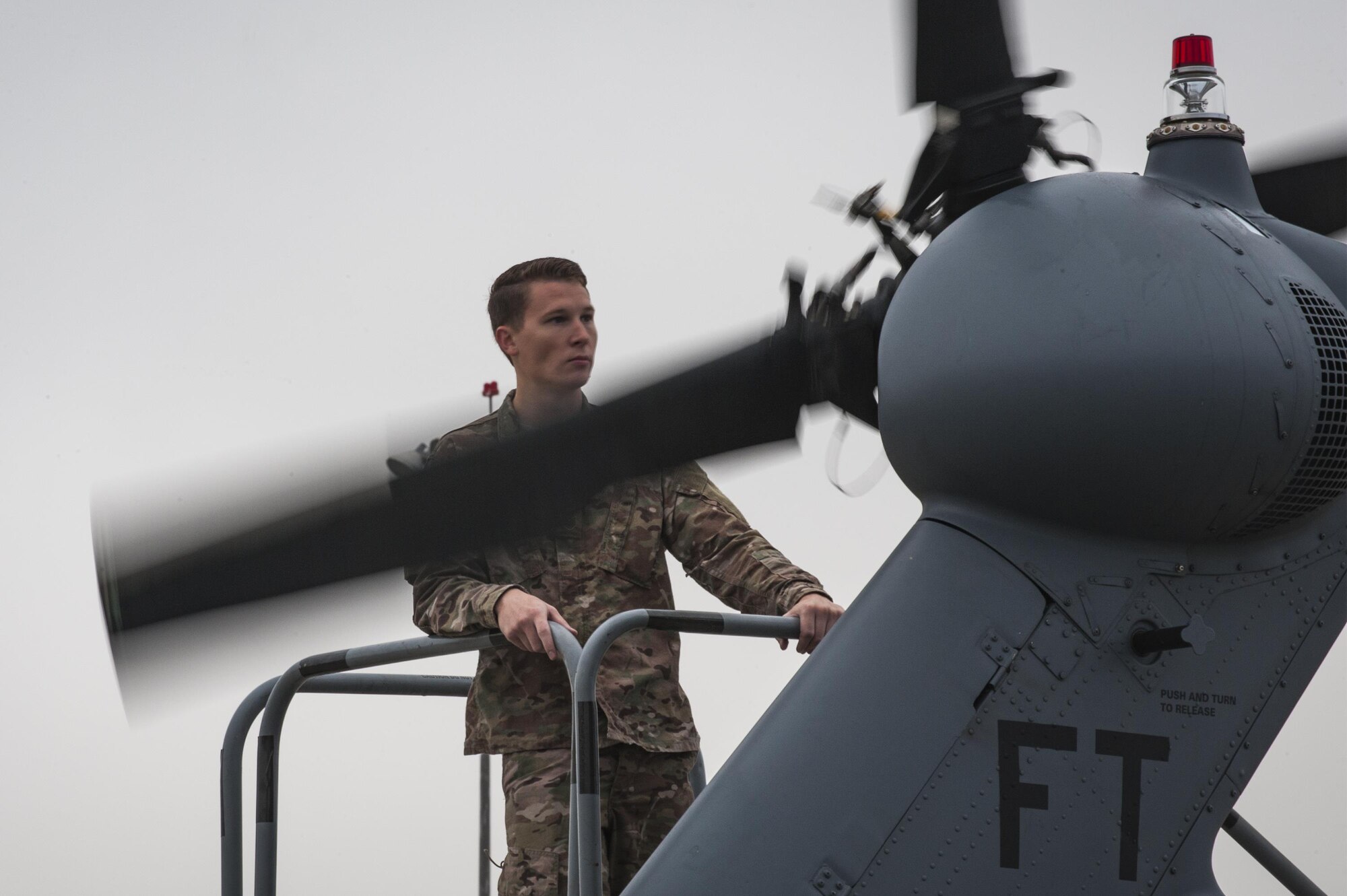 U.S. Air Force Staff Sgt. William Bennett, 41st Helicopter Maintenance unit flying crew chief, prepares to fold the tail rotor blades of an HH-60G Pave Hawk during rapid rescue preparation before the helicopter deployed, Sept. 13, 2016, at Moody Air Force Base, Ga. Airmen are capable of preparing a helicopter for transport in as little as four hours. (U.S. Air Force photo by Airman 1st Class Daniel Snider)