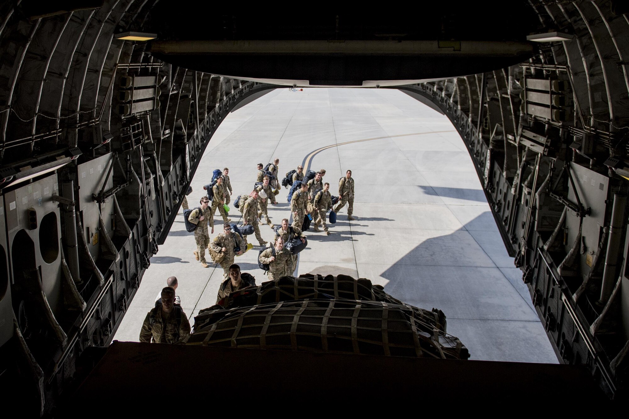 U.S. Air Force Airmen assigned to the 38th and 41st Rescue Squadrons board a C-17 Globemaster III before deploying to Southeast Europe, Sept. 26, 2016, at Moody Air Force Base, Ga. These Airmen are experts in personnel recovery, treatment and extraction in an array of environments. (U.S. Air Force photo by Airman 1st Class Daniel Snider)
