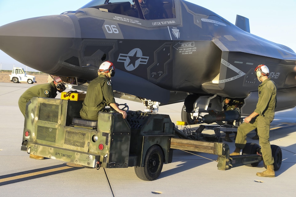 U.S. Marines with Marine Fighter Attack Squadron 121 (VMFA-121), 3rd Marine Aircraft Wing, conduct the first ever hot load on the F-35B Lightning II in support of Weapons and Tactics Instructor Course (WTI) 1-17 at Marine Corps Air Station Yuma, Ariz., Sept. 22, 2016. The exercise is part of WTI 1-17, a seven-week training event hosted by Marine Aviation Weapons and Tactics Squadron One (MAWTS-1) cadre. MAWTS-1 provides standardized tactical training and certification of unit instructor qualifications to support Marine Aviation Training and Readiness and assists in developing and employing aviation weapons and tactics. (U.S. Marine Corps photograph by SSgt. Artur Shvartsberg, MAWTS-1 COMCAM)