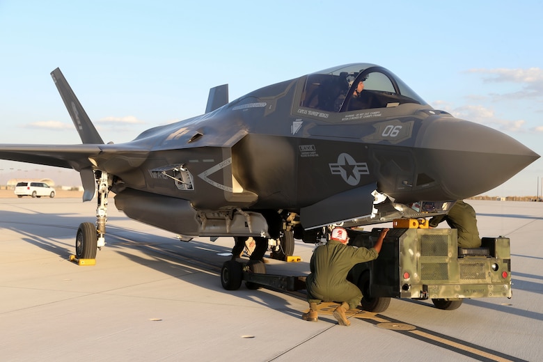 U.S. Marines with Marine Fighter Attack Squadron 121 (VMFA-121), 3rd Marine Aircraft Wing,  conduct the first ever hot load on the F-35B Lightning II in support of Weapons and Tactics Instructor Course (WTI) 1-17 at Marine Corps Air Station Yuma, Ariz., Sept. 22, 2016. The exercise is part of WTI 1-17, a seven-week training event hosted by Marine Aviation Weapons and Tactics Squadron One (MAWTS-1) cadre. MAWTS-1 provides standardized tactical training and certification of unit instructor qualifications to support Marine Aviation Training and Readiness and assists in developing and employing aviation weapons and tactics. (U.S. Marine Corps photograph by SSgt. Artur Shvartsberg, MAWTS-1 COMCAM)