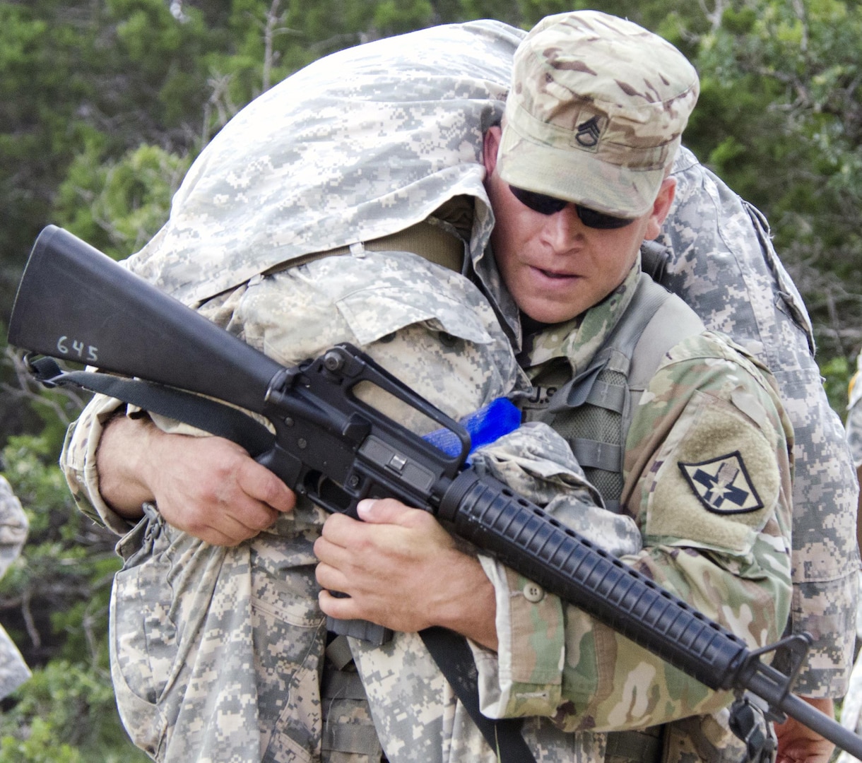 Staff Sgt. Jeremiah S. Gettler carryies an injured Soldier during the U.S. Army Medical Department Center & School 2016 Best Medic competition at Camp Bullis Sept. 12-14.