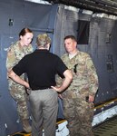 1st Lt. Hannah Shea (left), Army North G2 Operations Officer, and Chief Warrant Officer 2 David Mizelle (right), 505th Military Intelligence, discuss the CONUS Joint Mobile Intelligence Communications System, or CJMICS, load process with the 505th Military Intelligence Planning and Coordination team in preparation for the C-5 airlift to Corpus Christi Naval Station Sept. 16-18. 
