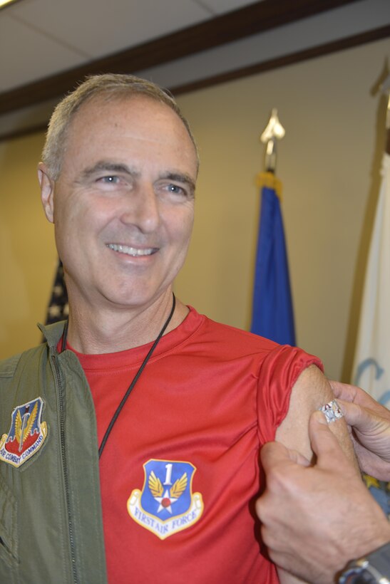 Lt. Gen. Scott Williams, Commander, 1st Air Force (Air Forces Northern) and Commander, Continental U.S. North American Aerospace Defense Command Region, gets his Bugs Bunny bandage after being first in line for the flu shot season Sept. 30.  The 1st AF surgeon's office is aiming to administer flu shots to approximately 600 command personnel.  (U.S. Air Force photo by Tom Saunders)