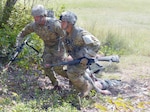 Sgt. 1st Class Stephen Eisele and 1st Lt. Chi Wing Pang from Brooke Army Medical Center drag a simulated casualty to safety during the Regional Health Command-Central (Provisional) 2016 Best Medic Competition at Camp Bullis Sept. 21. The combat medic lane tests the candidates’ ability to perform casualty care as well as their ability to evacuate wounded.