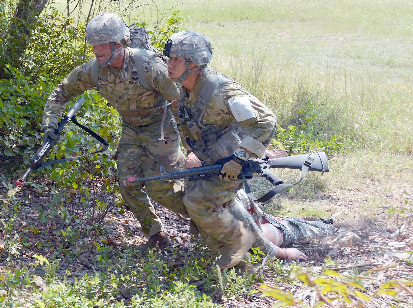 Sgt. 1st Class Stephen Eisele and 1st Lt. Chi Wing Pang from Brooke Army Medical Center drag a simulated casualty to safety during the Regional Health Command-Central (Provisional) 2016 Best Medic Competition at Camp Bullis Sept. 21. The combat medic lane tests the candidates’ ability to perform casualty care as well as their ability to evacuate wounded.