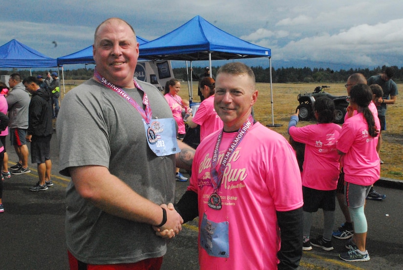 Sgt. Caleb Dodge, Headquarters and Headquarters Company, 301st Maneuver Enhancement Brigade and Army Reserve Command Sgt. Maj. James P. Wills, are all smiles at the conclusion of the Salmon Run held at Joint Base Lewis-McChord, September 17. (U.S Army Reserve photo by Spc. Sean Harding)