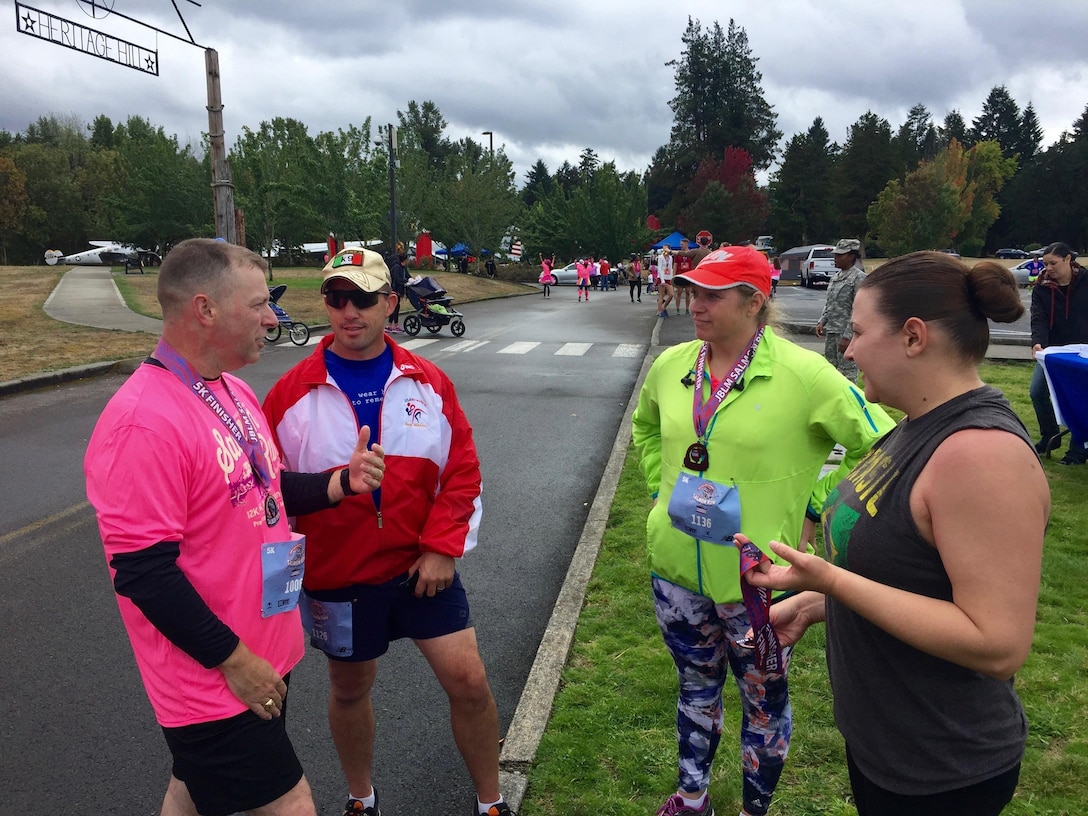 Army Reserve Command Sgt. Maj. James P. Wills chats with leaders at the conclusion of the Salmon Run September 17, at Joint-Base Lewis McChord. Wills wanted to challenge leaders to make sure all of their Soldiers are able to cross the finish line. (U.S. Army Reserve photo by Spc. Sean Harding)